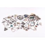 A large group of silver and costume jewellery to include a quantity of silver and white bracelets,