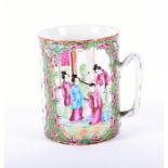 A 19th century Chinese Cantonese famille rose porcelain tankard enamelled with polychrome flowers,
