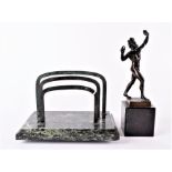 A German bronze study of a faun and a marble-based letter rack  the standing figure stamped Echte