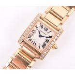 A Cartier Tank 18ct yellow gold and diamond ladies wristwatch the square silvered dial with black