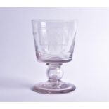 An early Victorian oversized hand-blown glass goblet the bucket shaped bowl etched with hops and