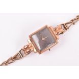 A 9ct rose gold ladies wristwatch with square dial, 16.6 grams.