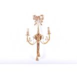 A Regency style gilt metal twin wall sconce with ribbon surmount and scroll arms, 58 cm.