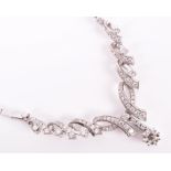 An 18ct white gold and diamond necklace suspended with a round brilliant-cut diamond of