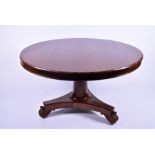A 19th century rosewood tilt-top breakfast table with plain frieze over an inverted tapering support