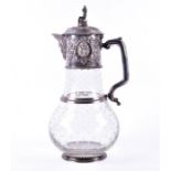 A large and impressive Victorian claret jug with silver-plated mounts decorated with fruiting vines,