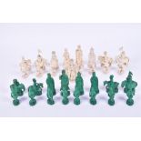 A large and finely carved 19th century ivory Chinese figural chess set  one side stained green,