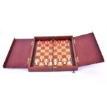 A large Whittington chess set late 19th to early 20th century, in a mahogany box, 30 x 30 cm (open).