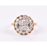 An 18ct yellow gold, platinum, and diamond cluster ring set with old-cut diamonds, size M, 6.4