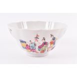 An 18th century Chinese famille rose bowl the scalloped-shape body decorated with panel scenes of