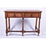 An early 20th century oak two-drawer side table on front ropetwist legs, 103 cm x 73 cm x 41 cm.