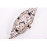 A 1930s Art Deco platinum and diamond ladies mechanical wristwatch the rectangular dial with