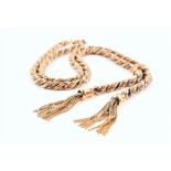 A 9ct yellow gold and silver chain rope-twist necklace with double tassels, the clasp stamped 375,