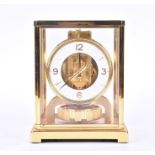 A gilt framed Jaeger-Le-Coultre Atmos Clock with white dial and gilt movement,  numbered 467409,