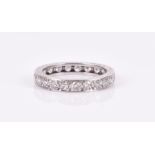 A diamond eternity ring pave set with round brilliant-cut diamonds, of approximately 0.18 carats