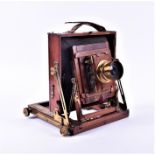 A British mahogany and bass mounted plate camera 'The Victo' by Thornton Pickard, numbered 18316.