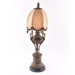 A French 19th century ormolu mounted marble lamp in the Empire style, with swan mounts against the