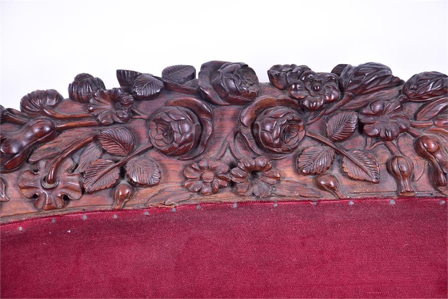 A 19th century European rosewood sofa the low back and frame with detailed carved fruit and - Image 17 of 26