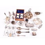 A group of silver items to include a set of four napkin rings in a wooden box, a silver salt