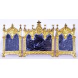 A decorative ecclesiastic gilt-metal framed mirror tryptic in the manner of A.W.N Pugin the