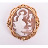 A yellow metal mounted cameo brooch depicting a Venus in a chariot surrounded with stylised