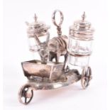 A Victorian novelty cruet set modelled as a silver plated donkey, with cut glass mustard and