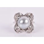 A diamond and pearl floral cluster ring centred with a round silver-grey pearl, 10 mm diameter,