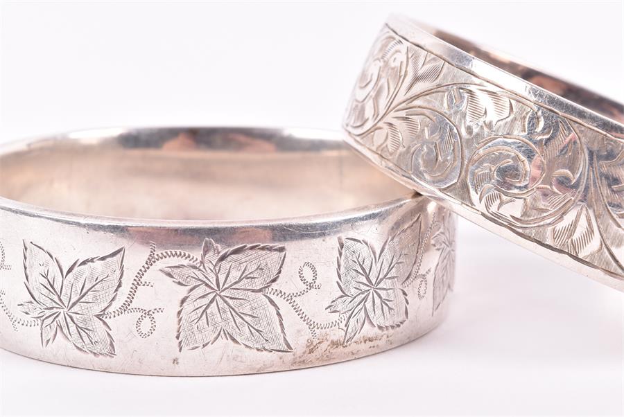 A Victorian Revivalist style silver bangle by Sydenham bros, together with three late 19th / early - Image 2 of 4