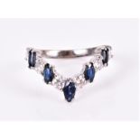 A diamond and sapphire wishbone ring set with six round brilliant-cut diamonds of approximately 0.70