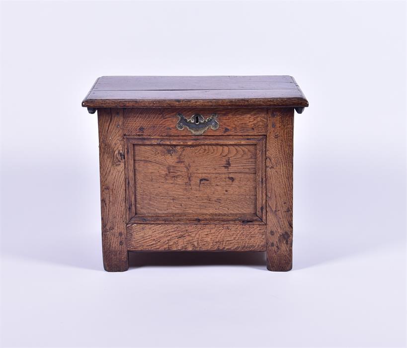 A late 17th century and later oak child's coffer with brass side handles and escutcheon, 52 cm x