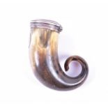 A 19th century Scottish white metal mounted horn snuff mull of typical curled form, with a hinged