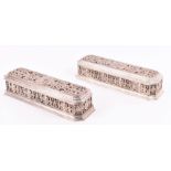 A pair of 20th century white metal caskets stamped J. Stadel, each of shaped rectangular form, the