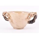 A Chinese soapstone libation cup  finely carved with floral branches to the handles either side, 6