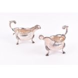 A pair of George III silver sauceboats London 1769, by William Skeen, each boat-shaped body with