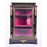 A Napoleon III ormolu mounted ebonised wood vitrine cabinet the top inlaid with a scrolled