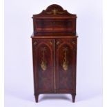 An Edwardian side cabinet of small proportions in the Sheraton revival style mahogany veneered, with