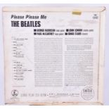 The Beatles: Please Please Me album cover signed to the reverse side by three John Lennon, Paul