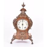 A 19th century cartouche shaped clock in the Louis XV style, the walnut case with gilt bronze mounts
