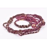 Two faceted ruby bead necklaces with 9ct gold clasps, together with a garnet beaded necklace and