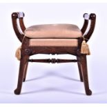 A Victorian carved walnut x frame stool with studded upholstered seat, the carved faceted frame with