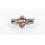 An 18ct white gold and diamond ring centred with a marquise-cut diamond of approximately 1.50