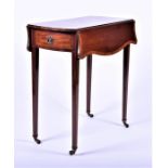 A small Edwardian mahogany Pembroke table with opposing drawers on tapering legs, 71 cm wide.