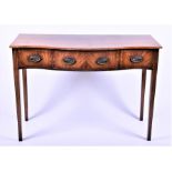 An Edwardian walnut veneered sideboard serpentine shaped with inlaid satinwood cross banding, the