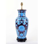 A large blue and purple Chinese porcelain lamp designed with clouds, lotus flowers, foliage and