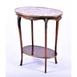 A French marble-topped and brass mounted side table of oval form, on swept feet united by under