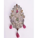 An Indian white metal, ruby, emerald, citrine, and topaz pendant the elaborate openwork mount