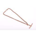 A 9ct rose gold curb-link Albert chain with cross bar, 25.8 grams.