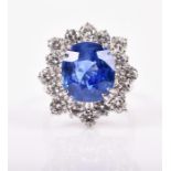 An impressive sapphire and diamond dress ring set with a natural, unheated rectangular cushion-cut