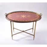 An Edwardian brass mounted and inlaid occasional table the oval top with satinwood marquetry inlay