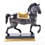 A large early 20th century patinated bronze model of a horse realistically modelled in a trotting